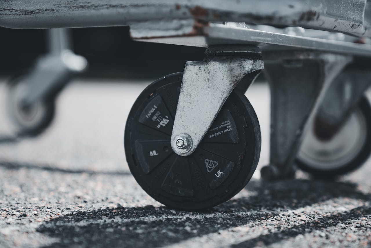 The Art of Drawing Readers In: Your attractive post title goes here Detailed image of a shopping cart wheel with focus on urban texture.