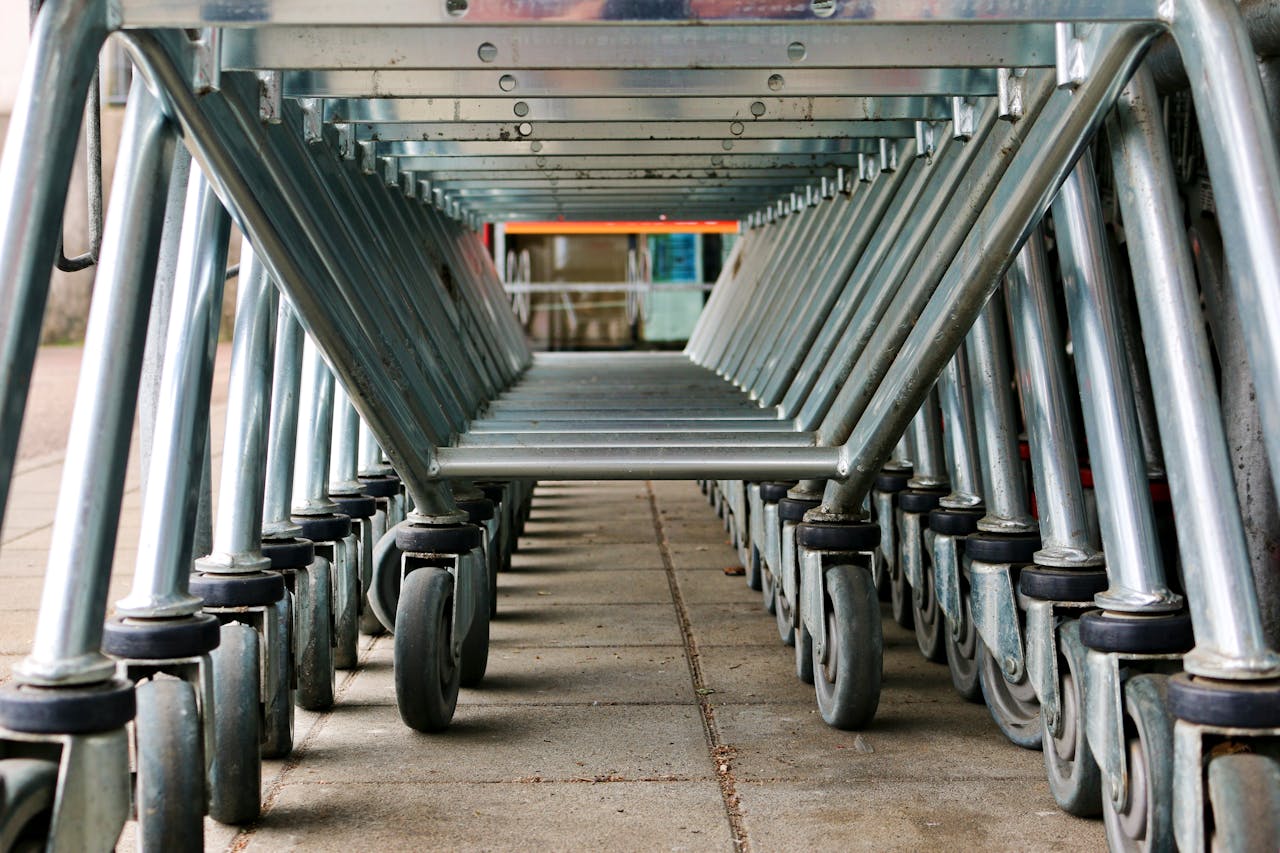 Crafting Captivating Headlines: Your awesome post title goes here A low-angle view of a row of metal shopping carts on concrete pavement in Ulm, Germany.